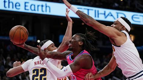 Jokic scores 31, Nuggets pull away from Wizards 118-104